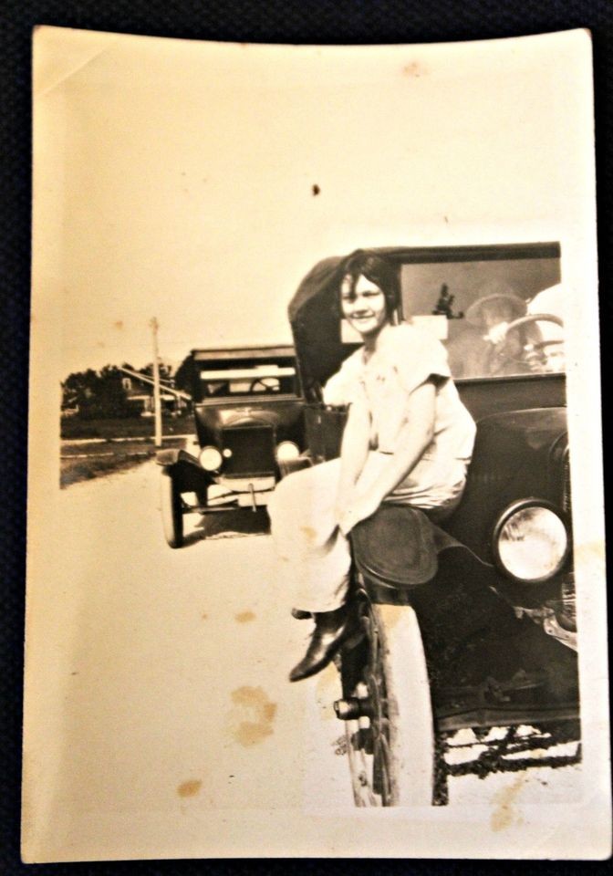 1920 photo Auto with a flapper sitting on bumper 1920 fashions 