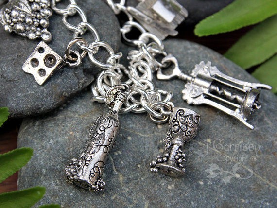   silver charm bracelet  cheese, wine, grapes, corkscrew, wine glass