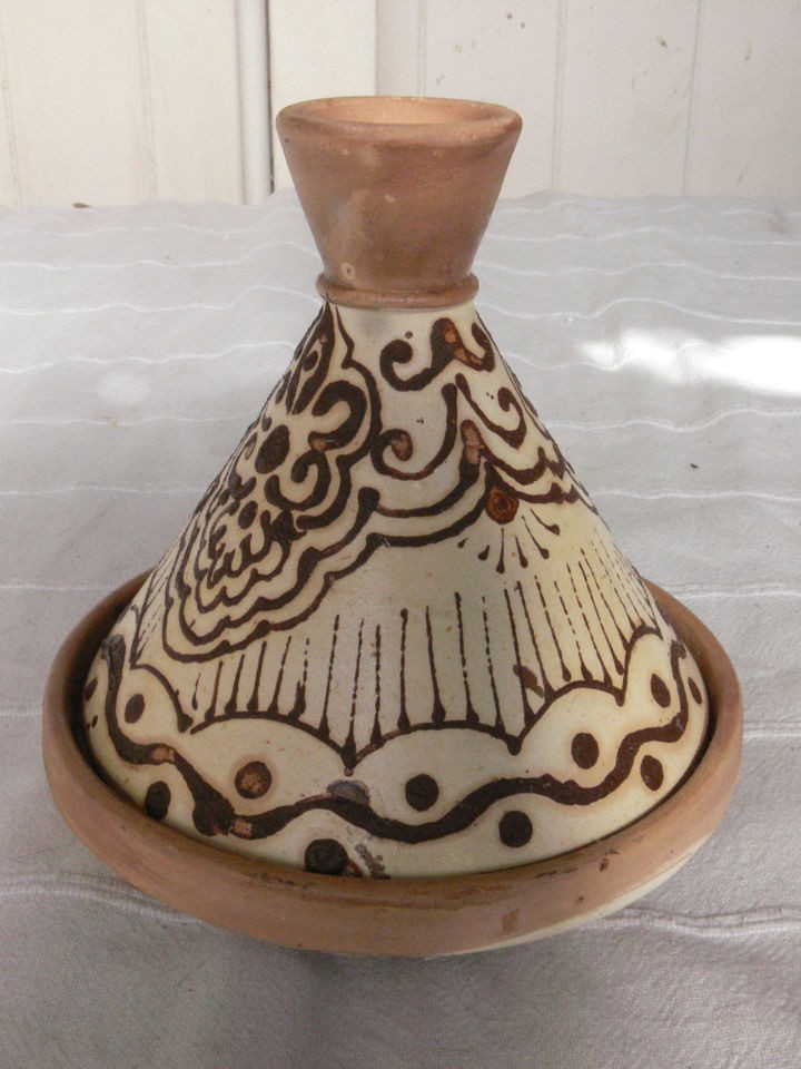 Moroccan handmade pottery tajine   design painted on with henna.