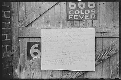 Sign on outside of tobacco warehouse during auction sales,Durham,North 