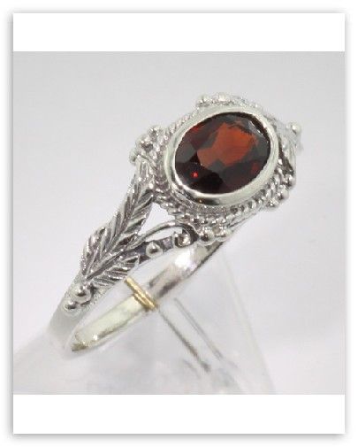  this beautiful garnet ring has a lovely vine leaf 