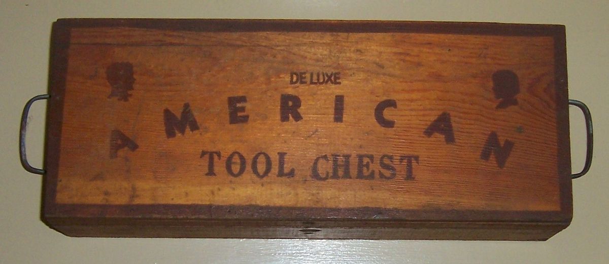    wooden Deluxe American Tool Chest filled with various small tools