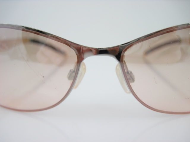 you are bidding on a pair of batali tan frameless rhinestone 