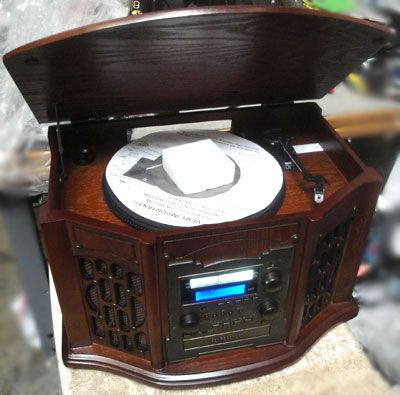 Features Turntable  Backlit LCD Display, Adjustable Speeds, AM/FM