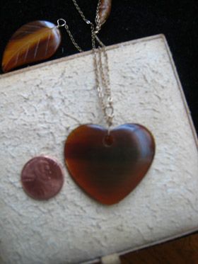 jami rodriquez burnished wood, heart, & leaf assymetrical gold chain