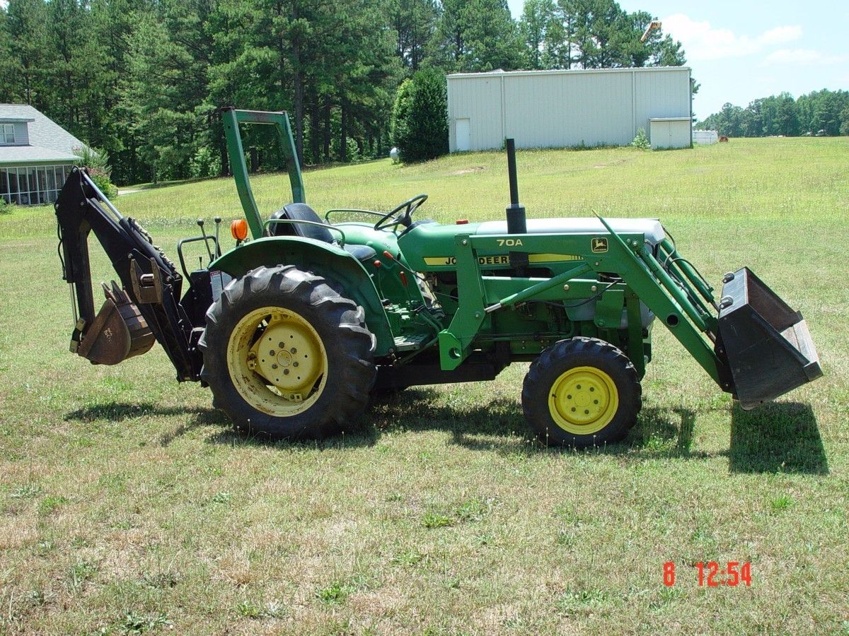 John Deere 850 4x4 with 70A Loader Woods 7500 Back Hoe