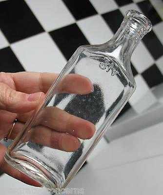 Little Old Bottle Embossed SYMBOL + iv on Side 5 3/5 tall   clear