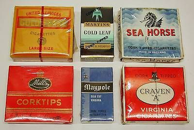 unopened packets of vintage cigarettes   1960s era   CRAVEN A; MAYPOLE