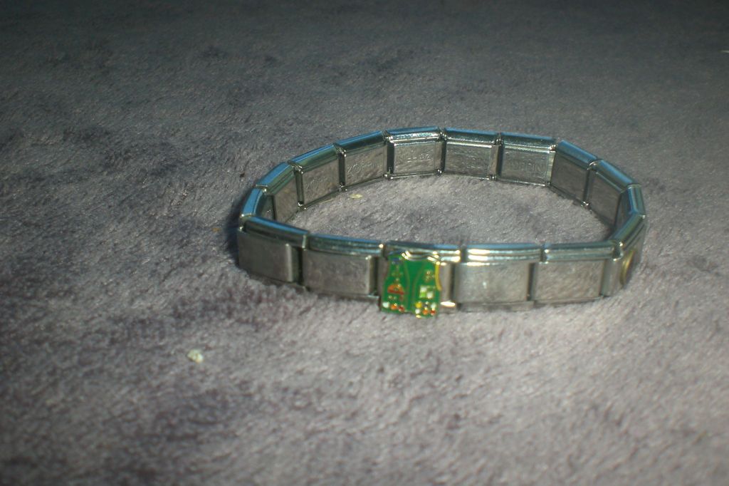 Italian charm braclet with some charms used in good shape